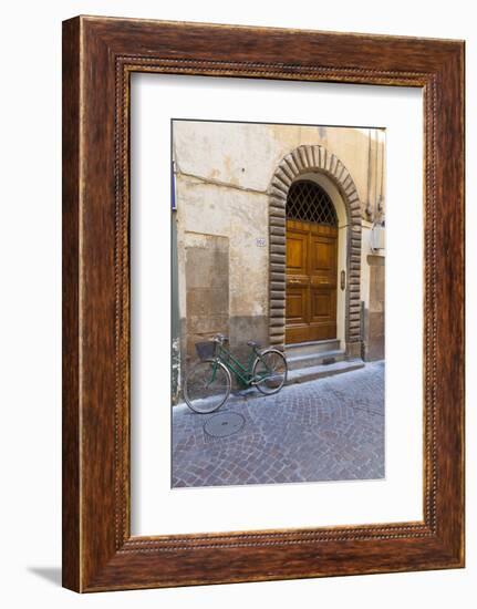 Bicycle parked outside front door, Lucca, Tuscany, Italy, Europe-John Guidi-Framed Photographic Print