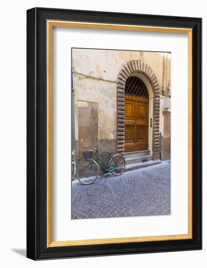 Bicycle parked outside front door, Lucca, Tuscany, Italy, Europe-John Guidi-Framed Photographic Print