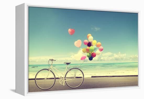 Bicycle Vintage with Heart Balloon on Beach Blue Sky Concept of Love in Summer and Wedding-jakkapan-Framed Premier Image Canvas