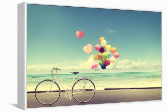 Bicycle Vintage with Heart Balloon on Beach Blue Sky Concept of Love in Summer and Wedding-jakkapan-Framed Premier Image Canvas