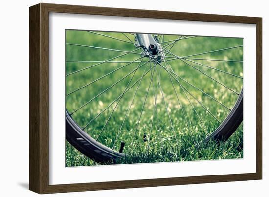 Bicycle Wheel in Grass-null-Framed Photo