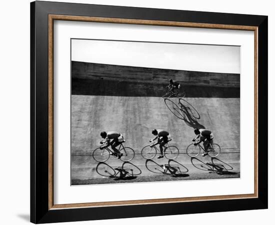 Bicycles Forming Distorted Designs on Track as Peddlers Grind Away in the 4,000 Meter Team Pursuit-Ralph Crane-Framed Photographic Print