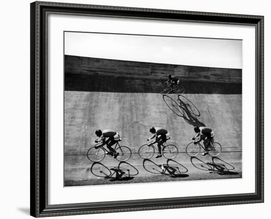 Bicycles Forming Distorted Designs on Track as Peddlers Grind Away in the 4,000 Meter Team Pursuit-Ralph Crane-Framed Photographic Print