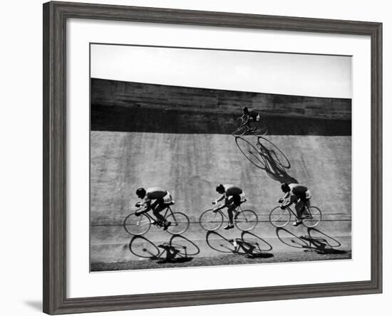 Bicycles Forming Distorted Designs on Track as Peddlers Grind Away in the 4,000 Meter Team Pursuit-Ralph Crane-Framed Photographic Print