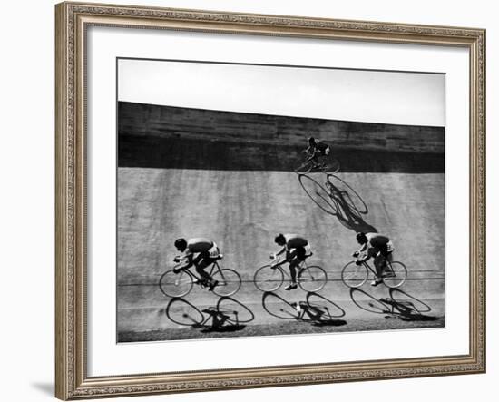 Bicycles Forming Distorted Designs on Track as Peddlers Grind Away in the 4,000 Meter Team Pursuit-Ralph Crane-Framed Photographic Print