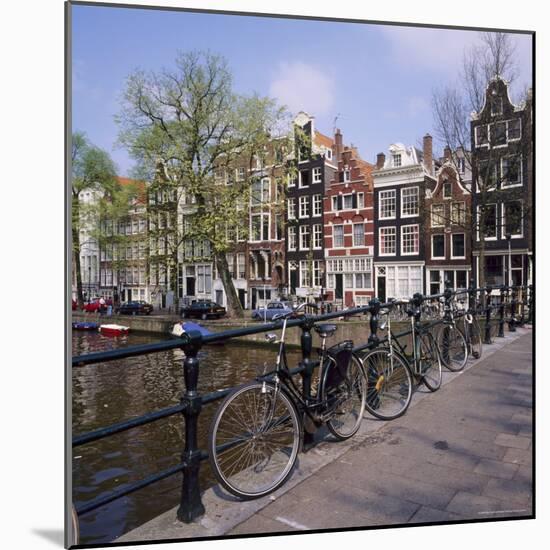 Bicycles on a Bridge Across the Canal at Herengracht in Amsterdam, Holland-Roy Rainford-Mounted Photographic Print