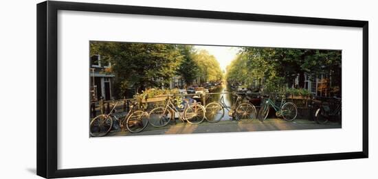 Bicycles on Bridge Over Canal, Amsterdam, Netherlands-null-Framed Photographic Print