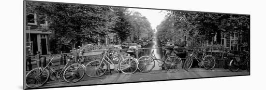 Bicycles on Bridge over Canal, Amsterdam, Netherlands-null-Mounted Photographic Print