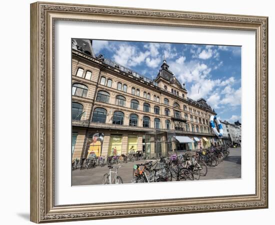 Bicycles parked in front of the Magasin du Nord department store, Copenhagen, Denmark, Scandinavia-Jean Brooks-Framed Photographic Print