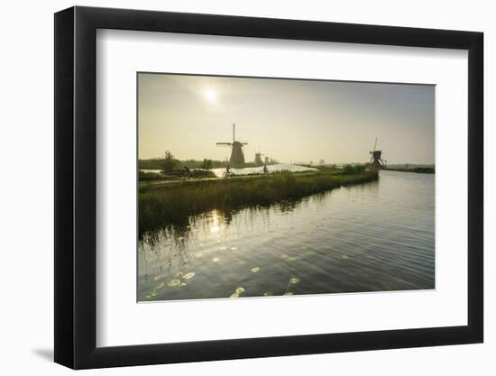 Bicycles Run Through a Path Between the Canal and Windmills, Netherlands-Roberto Moiola-Framed Photographic Print