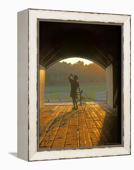 Bicyclist at Covered Bridge, Iowa, USA-Chuck Haney-Framed Premier Image Canvas