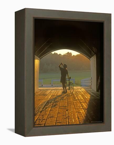 Bicyclist at Covered Bridge, Iowa, USA-Chuck Haney-Framed Premier Image Canvas