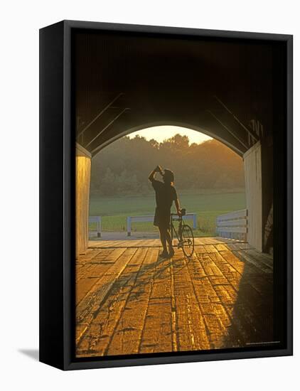 Bicyclist at Covered Bridge, Iowa, USA-Chuck Haney-Framed Premier Image Canvas