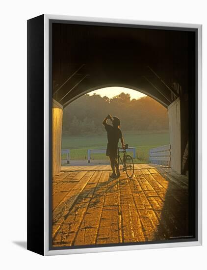 Bicyclist at Covered Bridge, Iowa, USA-Chuck Haney-Framed Premier Image Canvas