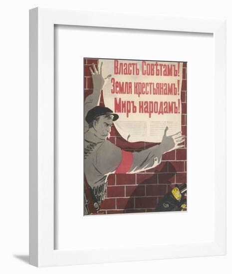 Big Brave Communist Worker Fixes a Poster on a Wall-null-Framed Photographic Print