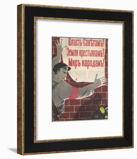 Big Brave Communist Worker Fixes a Poster on a Wall-null-Framed Photographic Print