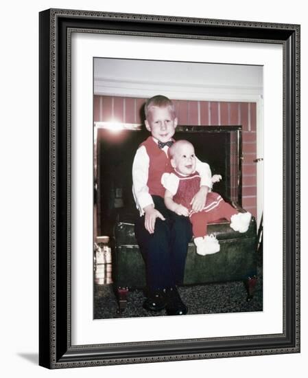 Big Brother Holds His Baby Sister for a Portrait, Ca. 1960.-Kirn Vintage Stock-Framed Photographic Print
