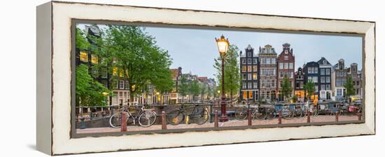 Bikes and Houses Along Canal at Dusk at Intersection of Herengracht and Brouwersgracht-null-Framed Stretched Canvas