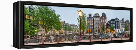 Bikes and Houses Along Canal at Dusk at Intersection of Herengracht and Brouwersgracht-null-Framed Stretched Canvas