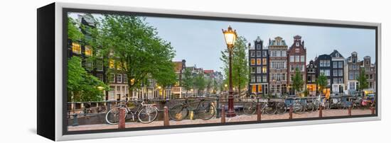 Bikes and Houses Along Canal at Dusk at Intersection of Herengracht and Brouwersgracht-null-Framed Stretched Canvas