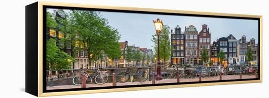 Bikes and Houses Along Canal at Dusk at Intersection of Herengracht and Brouwersgracht-null-Framed Stretched Canvas