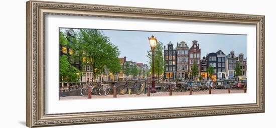 Bikes and Houses Along Canal at Dusk at Intersection of Herengracht and Brouwersgracht--Framed Photographic Print