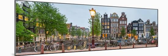 Bikes and Houses Along Canal at Dusk at Intersection of Herengracht and Brouwersgracht-null-Mounted Photographic Print