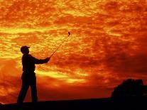 Man Swinging Golf Club at Sunset-Bill Bachmann-Photographic Print