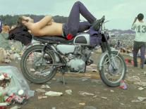 Shirtless Man in Levi Strauss Jeans Lying on Motorcycle Seat at Woodstock Music Festival-Bill Eppridge-Photographic Print