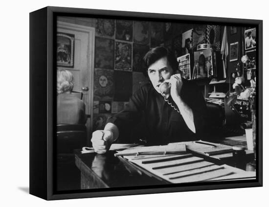 Bill Graham, Owner of Filmores East and West, Talking on Phone as He Works in His Office-John Olson-Framed Premier Image Canvas