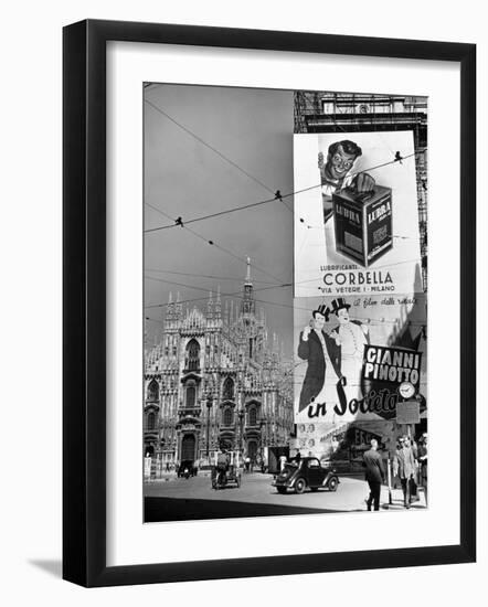 Billboard in the Piazza Del Duomo features Abbott and Costello, Whom Italians Call Cianni E Pinotto-Alfred Eisenstaedt-Framed Photographic Print