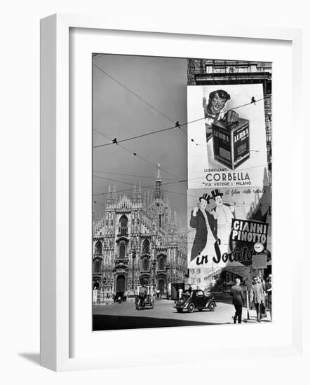 Billboard in the Piazza Del Duomo features Abbott and Costello, Whom Italians Call Cianni E Pinotto-Alfred Eisenstaedt-Framed Photographic Print