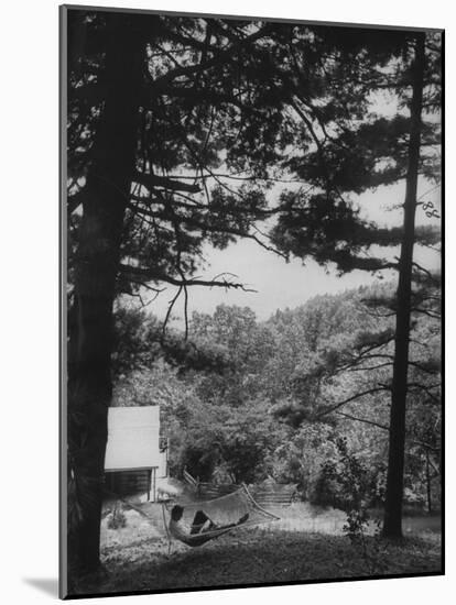 Billy Graham Reading the Bible Outside the Cabin Where He Seeks Seclusion-Ed Clark-Mounted Photographic Print