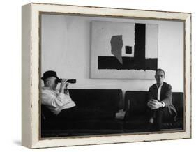 Billy Wilder in His Hollywood Office, Looking Through Binoculars-Gjon Mili-Framed Premier Image Canvas