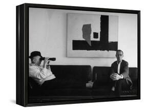 Billy Wilder in His Hollywood Office, Looking Through Binoculars-Gjon Mili-Framed Premier Image Canvas