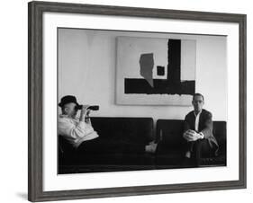 Billy Wilder in His Hollywood Office, Looking Through Binoculars-Gjon Mili-Framed Premium Photographic Print