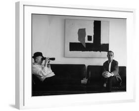 Billy Wilder in His Hollywood Office, Looking Through Binoculars-Gjon Mili-Framed Premium Photographic Print