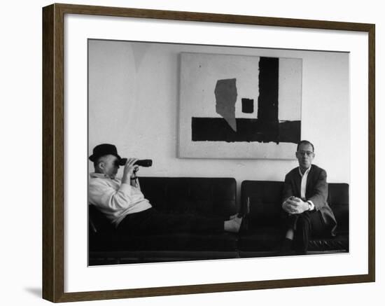 Billy Wilder in His Hollywood Office, Looking Through Binoculars-Gjon Mili-Framed Premium Photographic Print