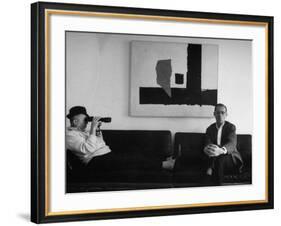Billy Wilder in His Hollywood Office, Looking Through Binoculars-Gjon Mili-Framed Premium Photographic Print