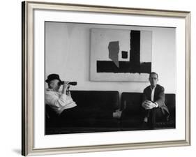 Billy Wilder in His Hollywood Office, Looking Through Binoculars-Gjon Mili-Framed Premium Photographic Print