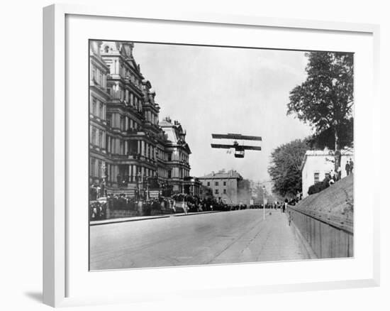 Biplane Flying over Washington-null-Framed Photographic Print