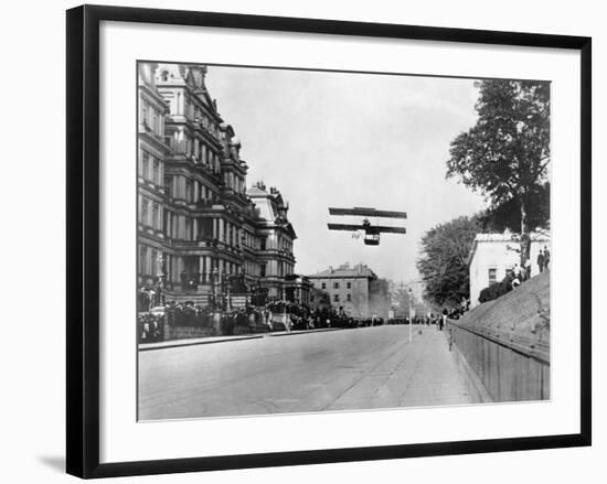 Biplane Flying over Washington-null-Framed Photographic Print