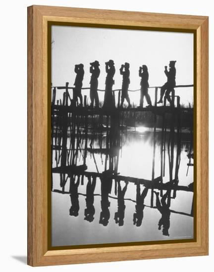 Bird Counters of the Audubon Society Standing on a Bridge-Francis Miller-Framed Premier Image Canvas