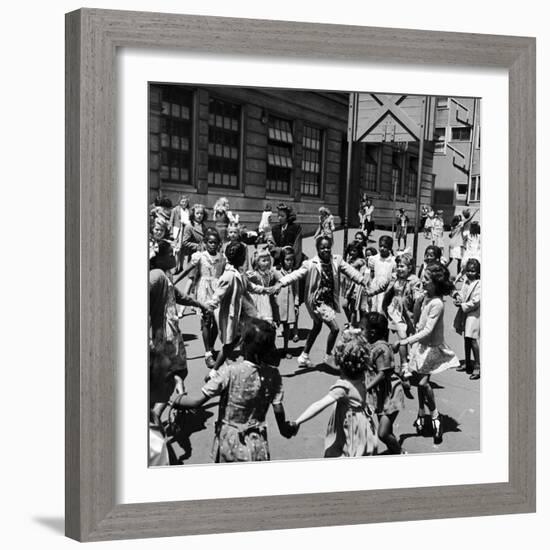 Black and White Children Playing in School Playground-Peter Stackpole-Framed Photographic Print