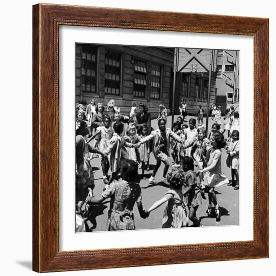 Black and White Children Playing in School Playground-Peter Stackpole-Framed Photographic Print