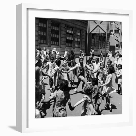 Black and White Children Playing in School Playground-Peter Stackpole-Framed Photographic Print