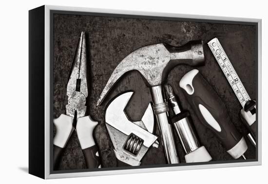 Black and White Image of a Set of Tools on a Textured Metallic Background-Kamira-Framed Premier Image Canvas