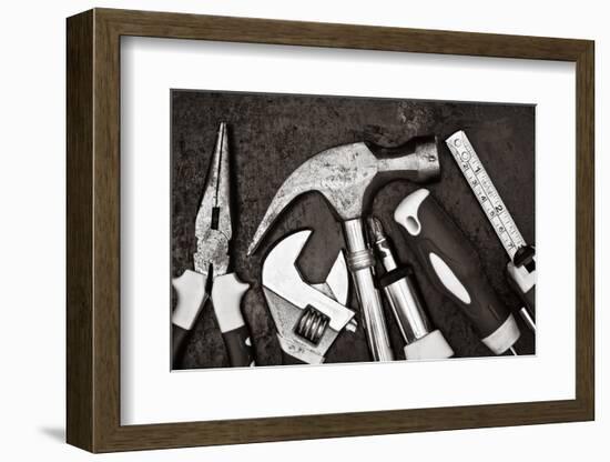 Black and White Image of a Set of Tools on a Textured Metallic Background-Kamira-Framed Photographic Print