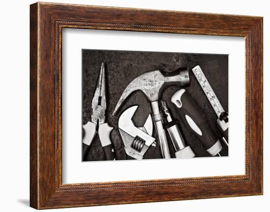 Black and White Image of a Set of Tools on a Textured Metallic Background-Kamira-Framed Photographic Print