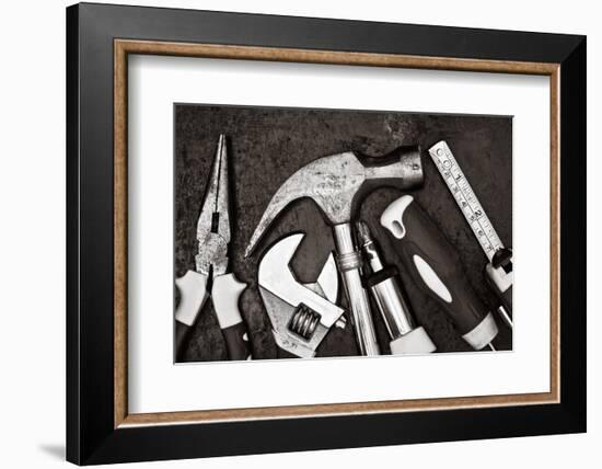 Black and White Image of a Set of Tools on a Textured Metallic Background-Kamira-Framed Photographic Print